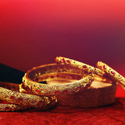 Gold emobossed designs with stone matte finish bangles