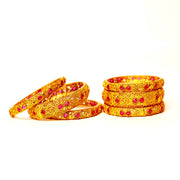 Gold emobossed designs with stone matte finish bangles