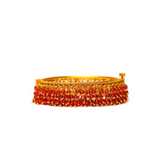 Matte gold bangles with orange beads