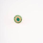 Green white stone-studded circular finger ring.